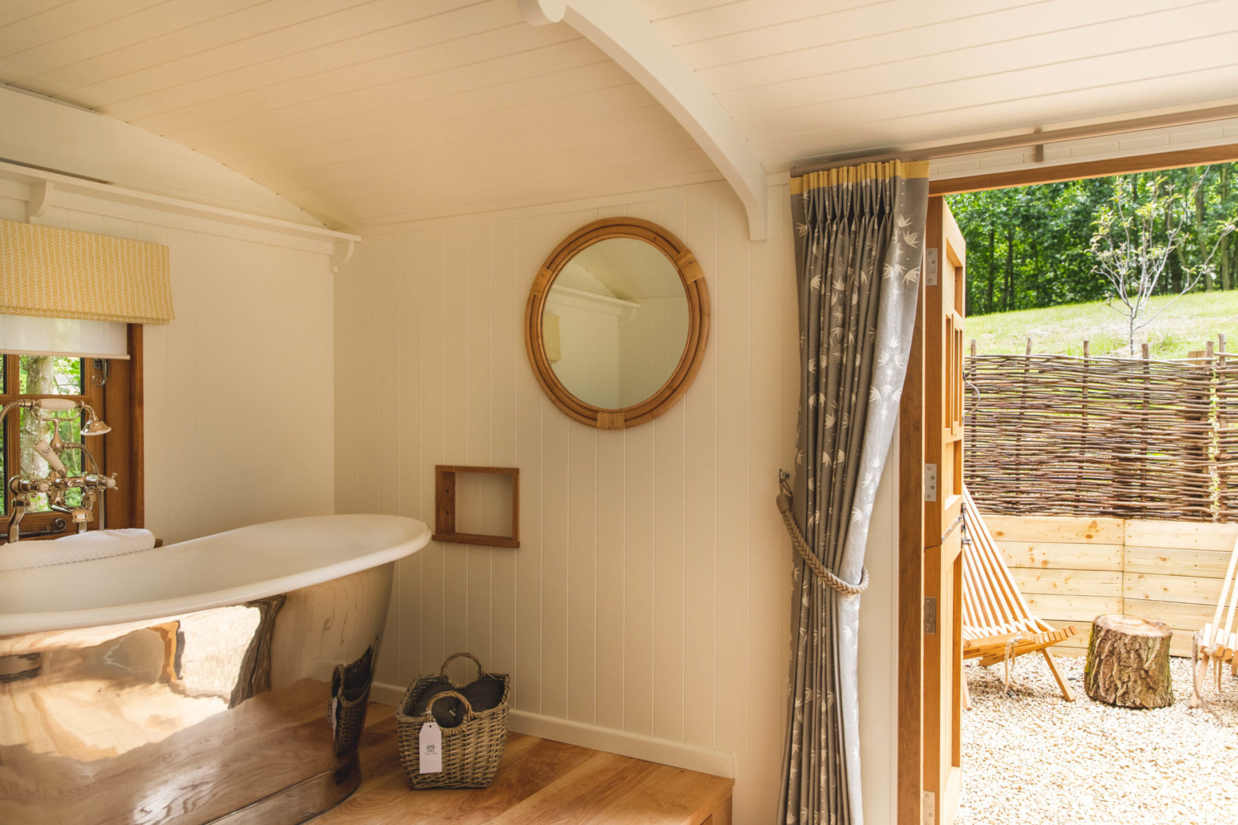Aerial panoramic view of The Fish Hotel settled into the Cotswold hillside on Farncombe Estate