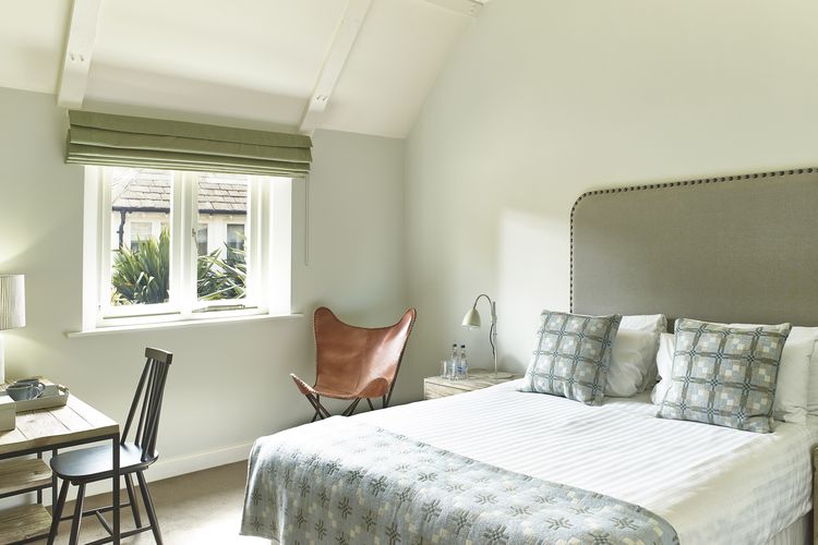 Medium Room bedroom interior in The Stables with Scandinavian chic styling
