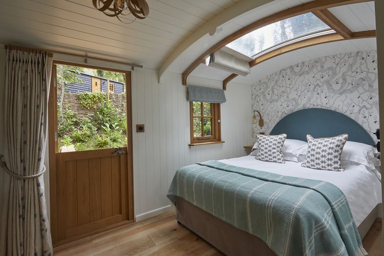 Hideaway Hut exterior nestled in Cotswold woodland
