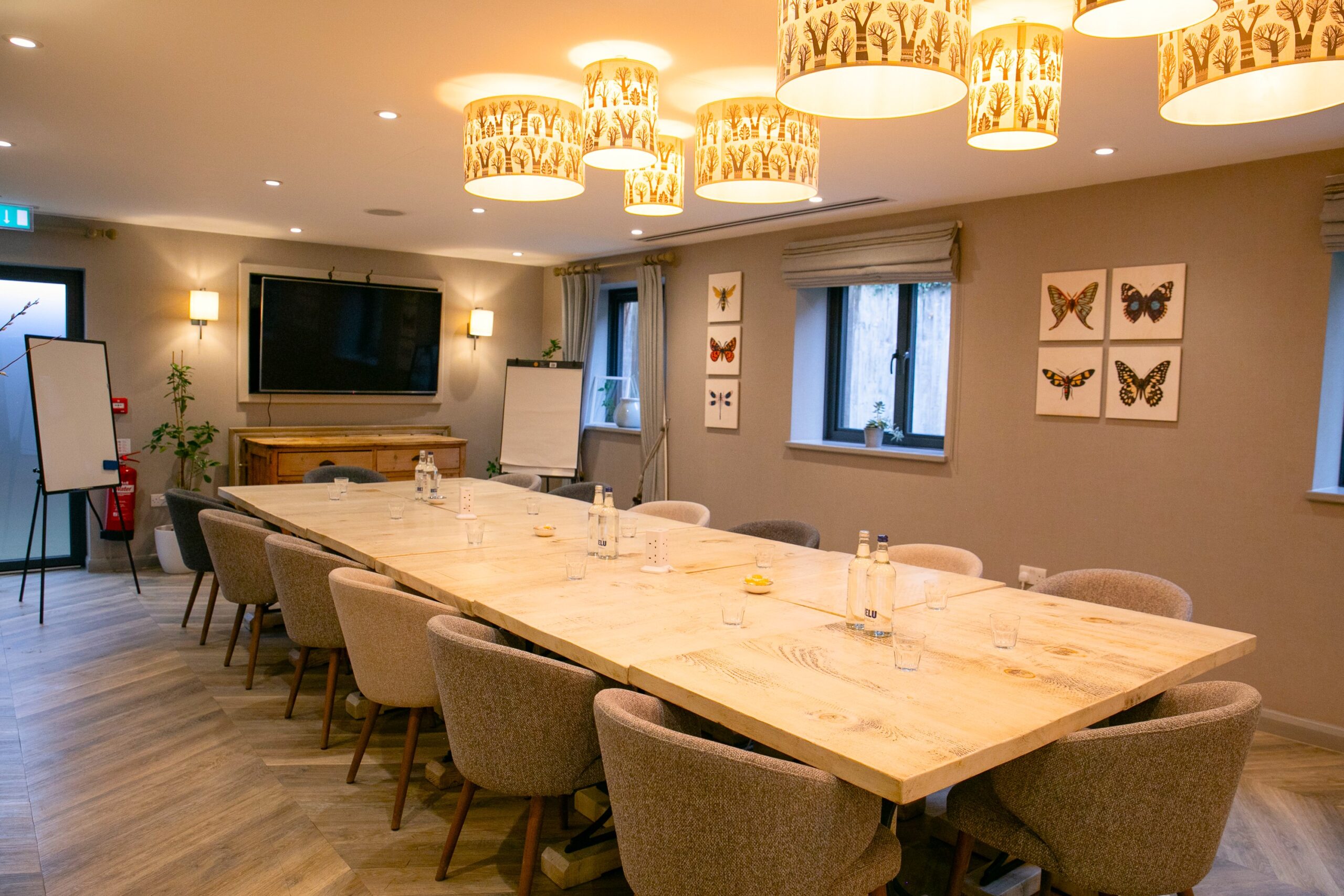 The Cabin boardroom setup with executive seating and breakout lounge area